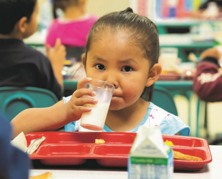 St. Bonaventure Navajo girl drinking milk