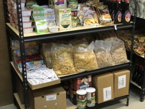 Black pantry shelf featuring stocked grains and cereals